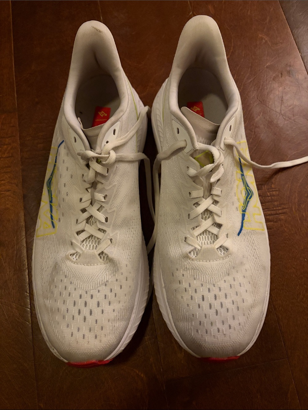 Hoka White Athletic Shoes with Yellow & Blue Accents